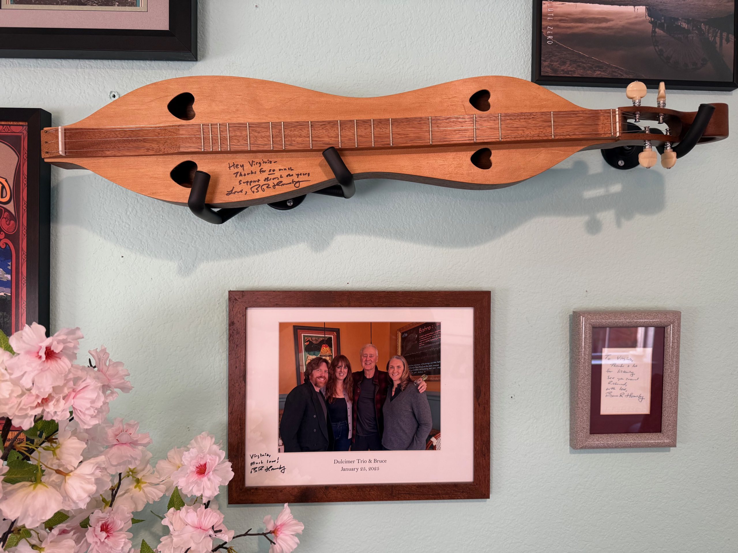 Hornsby shrine in Virginia's office. Signed mandolin from the lunch & signed napkin from an encounter at age 18.